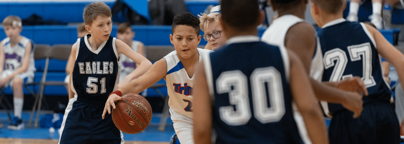 Basketball player weaving through opponents